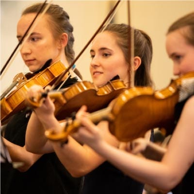 three heifetz violinists perform